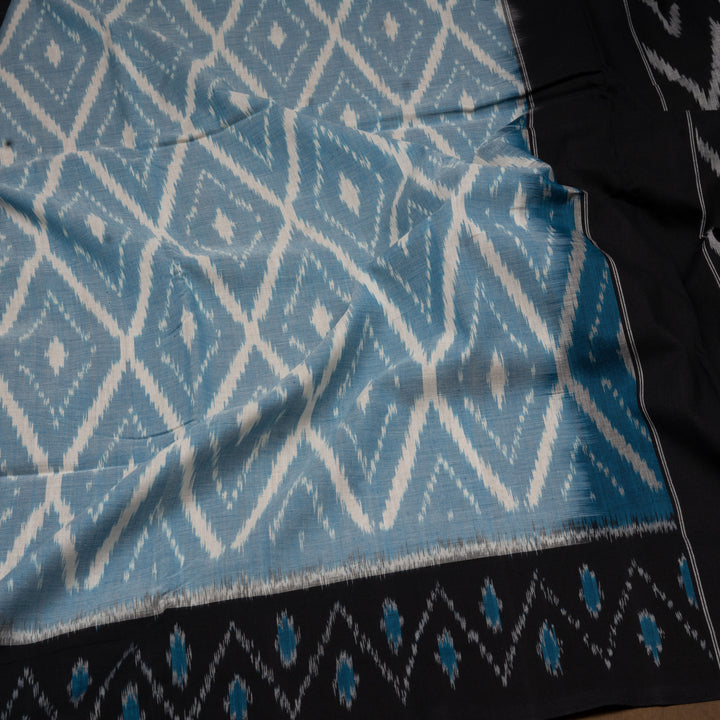 Closeup of Handwoven sky blue with maroon pallu ikkat cotton Saree