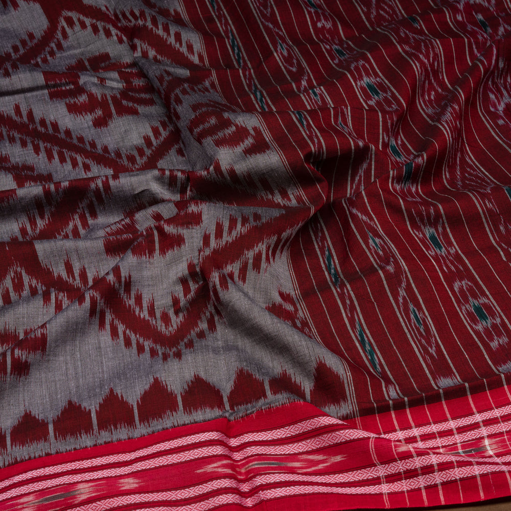 Closeup of Handwoven grey  with maroon pallu ikkat cotton Saree