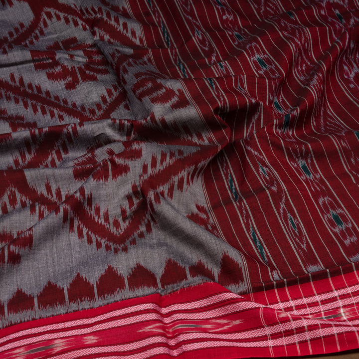 Closeup of Handwoven grey  with maroon pallu ikkat cotton Saree
