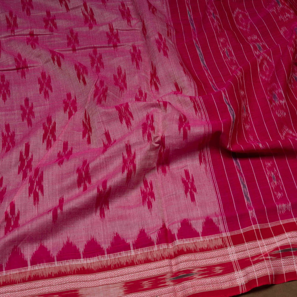Pink and red patterned fabric with a focus on texture and color.