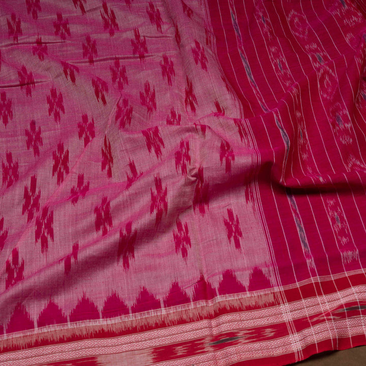 Pink and red patterned fabric with a focus on texture and color.