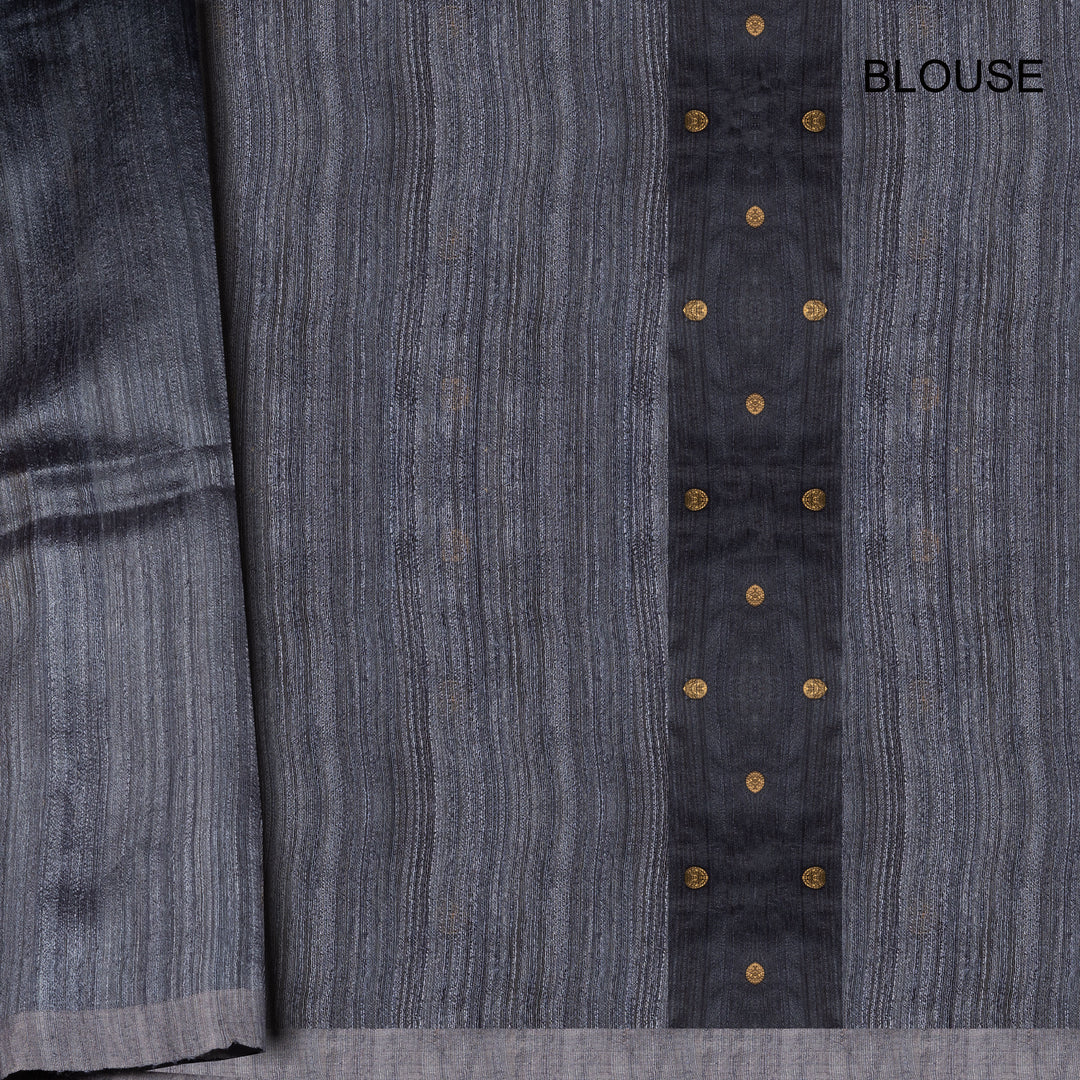 Gray blouse with button details on a gray background