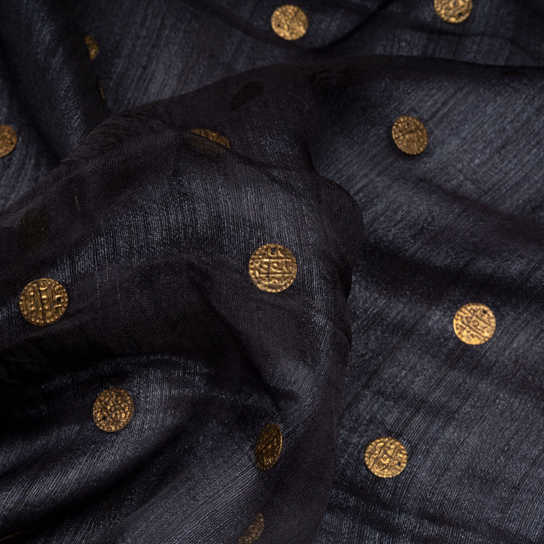 Navy fabric with gold circular patterns
