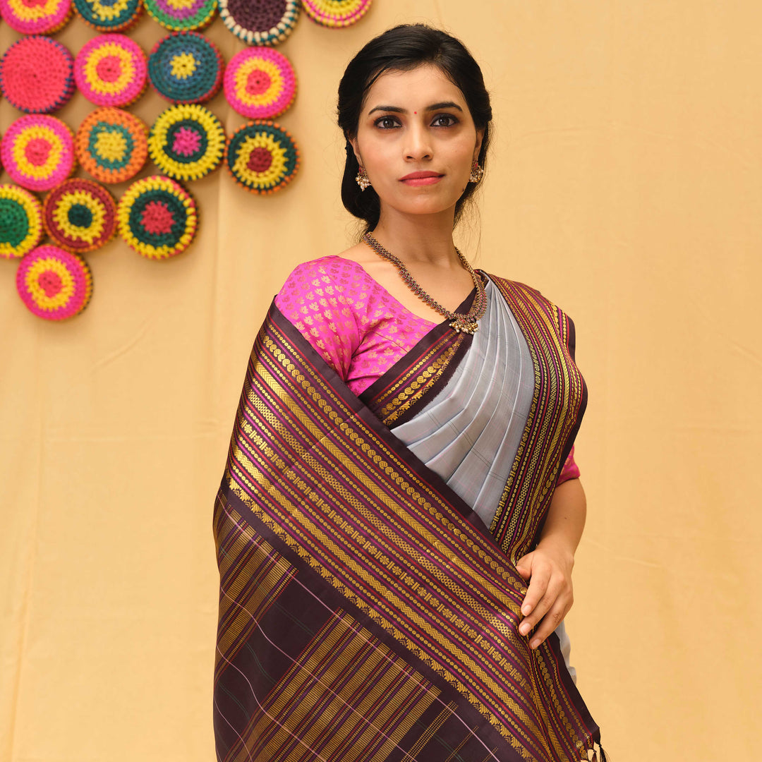 wearing a traditional saree with a colorful background
