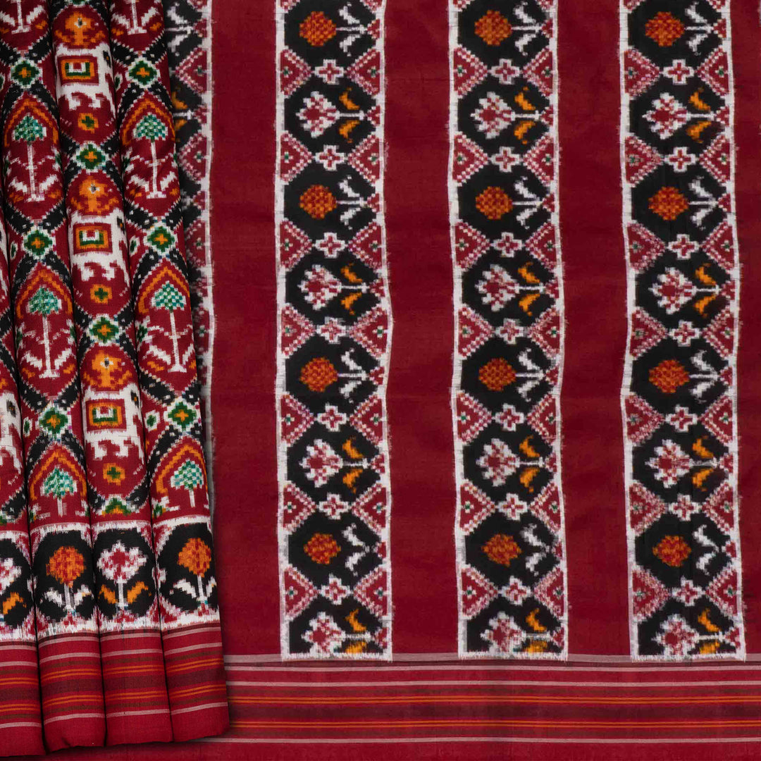 Traditional fabric with intricate patterns on a red background