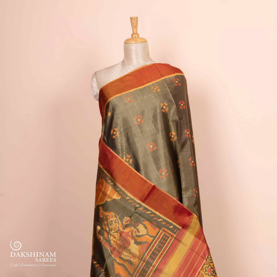 Pleats/body of Handwoven moss grey and orange Ikkat silk Saree
