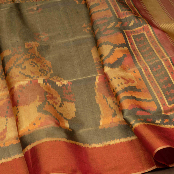 Closeup of Handwoven moss grey and orange Ikkat silk Saree