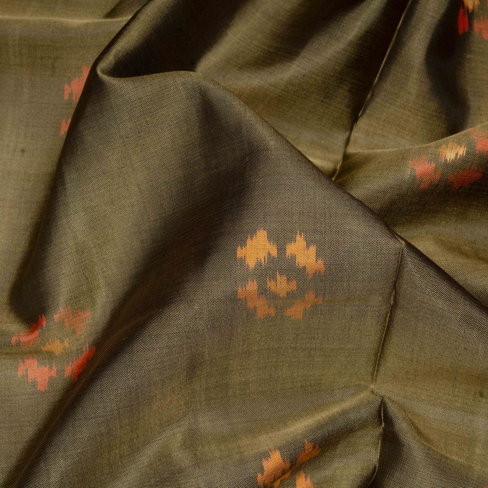 Close-up of olive green fabric with subtle patterns