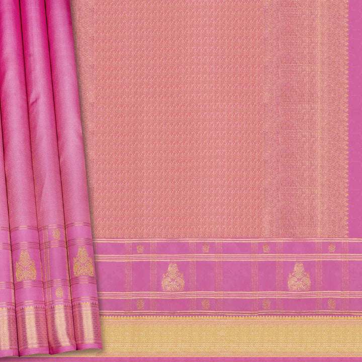 Pink and gold traditional fabric with a border design