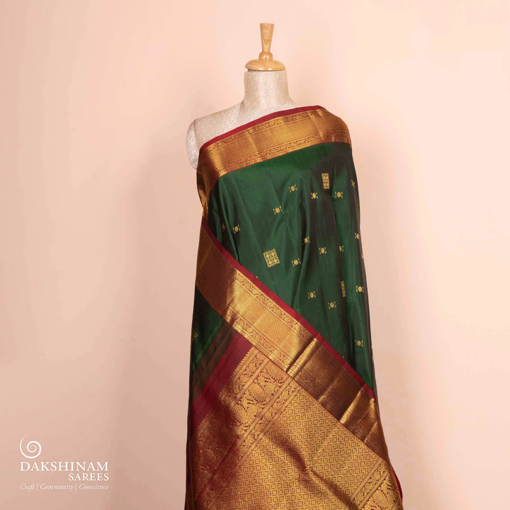 Pleats/body of Handwoven bottle green and maroon kanjivaram silk Saree