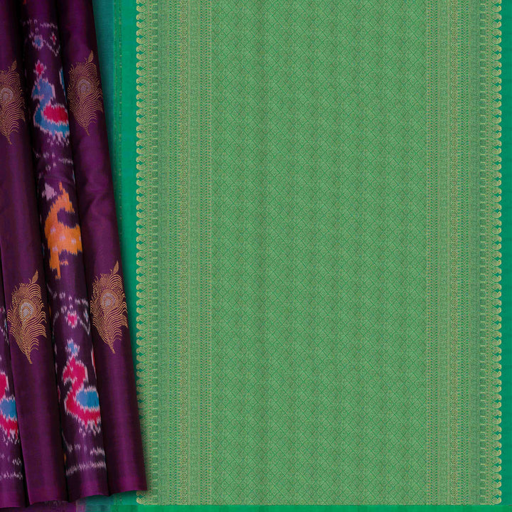 Green fabric with a textured pattern next to a purple fabric with peacock designs.