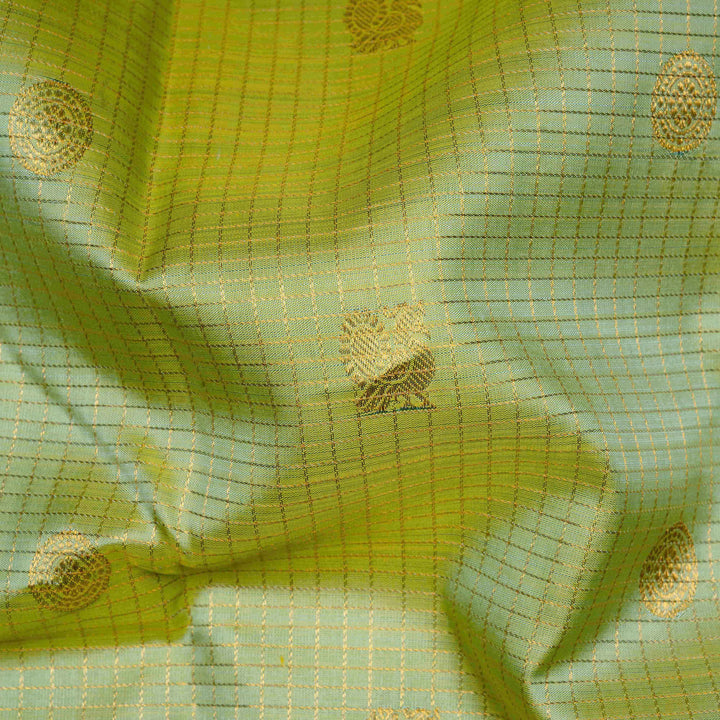 Close-up of green fabric with gold patterns