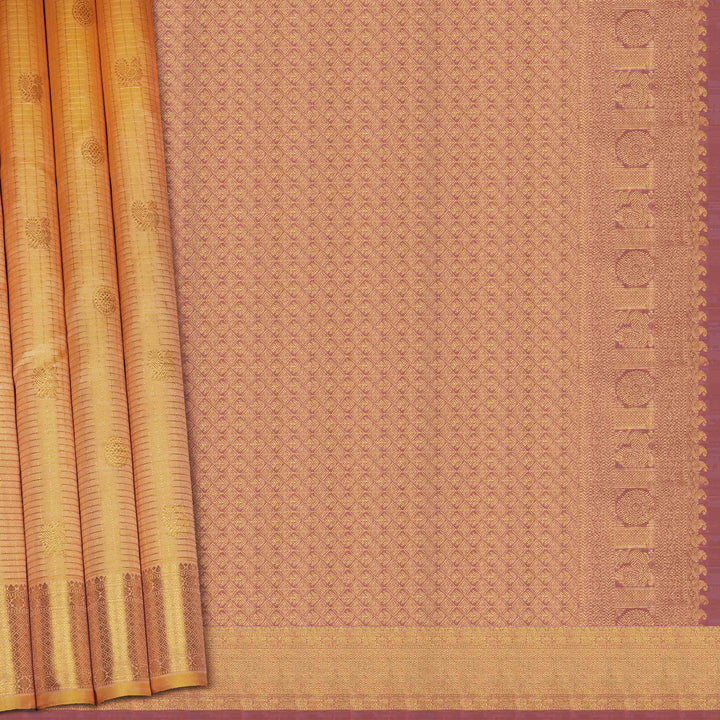 Brown saree with a subtle pattern and gold border