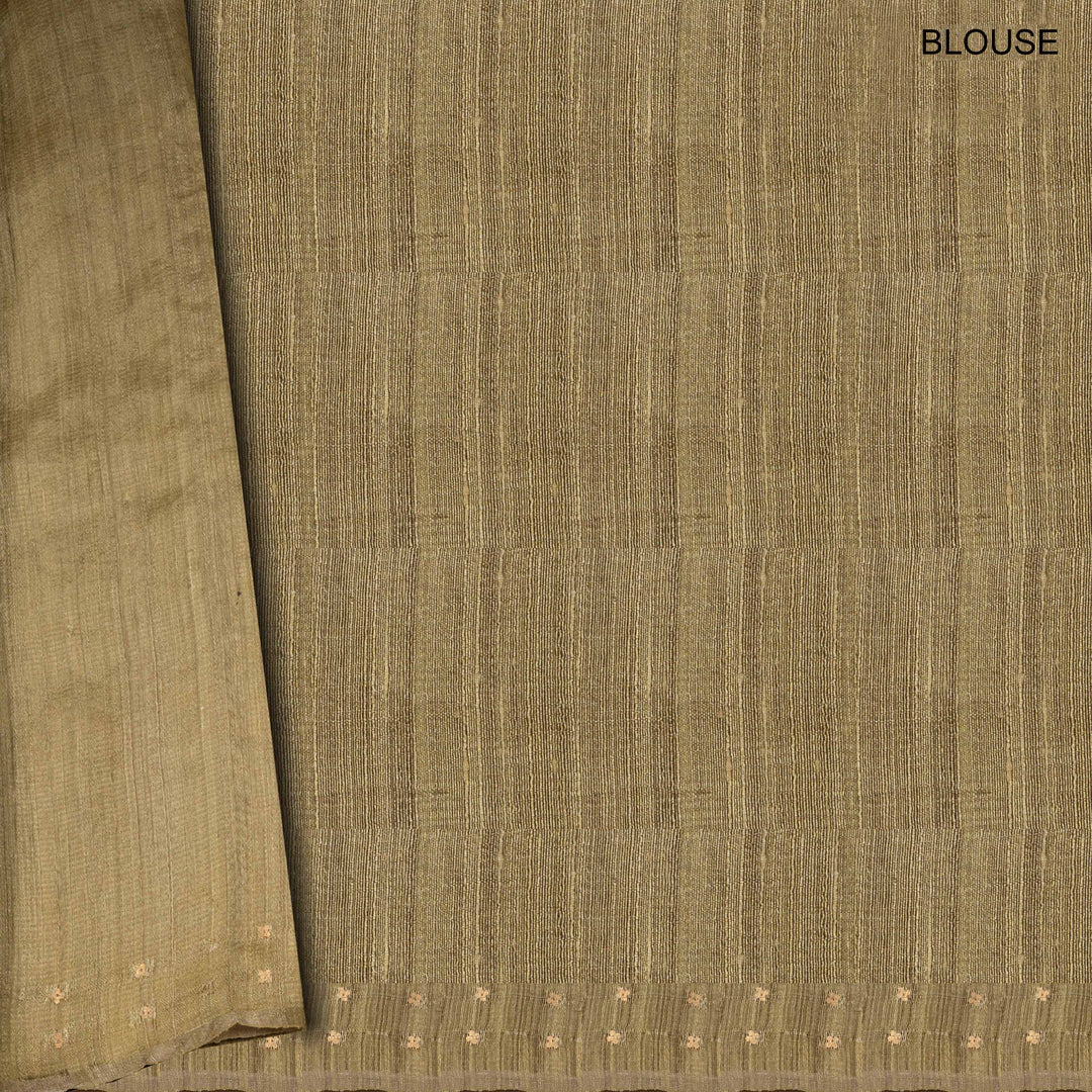 Close-up of brown fabric with a subtle pattern, labeled 'BLOUSE'.