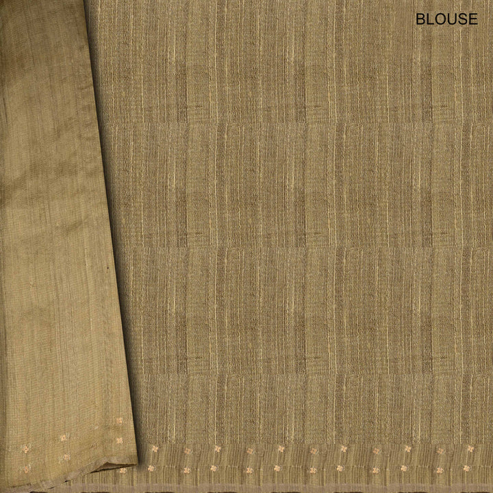 Close-up of brown fabric with a subtle pattern, labeled 'BLOUSE'.