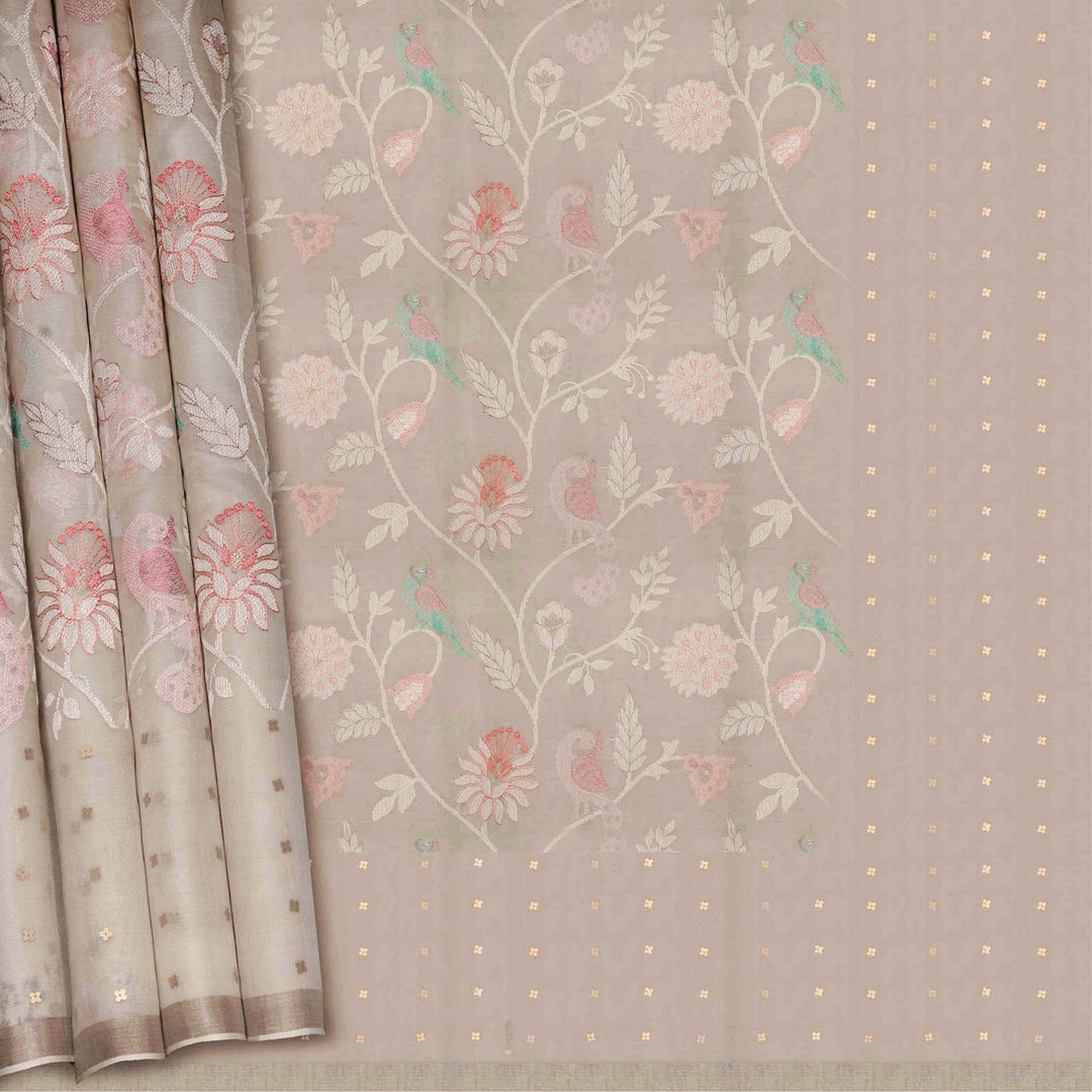 Floral and bird patterned fabric with a soft color palette on a neutral background