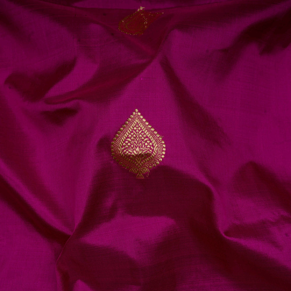 Close-up of purple fabric with gold embroidery