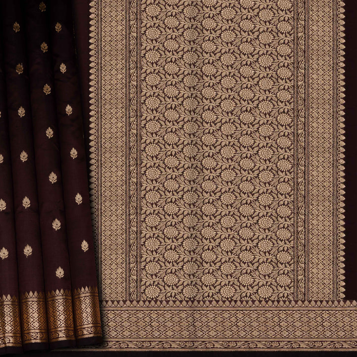 Brown fabric with intricate gold patterns on a dark background