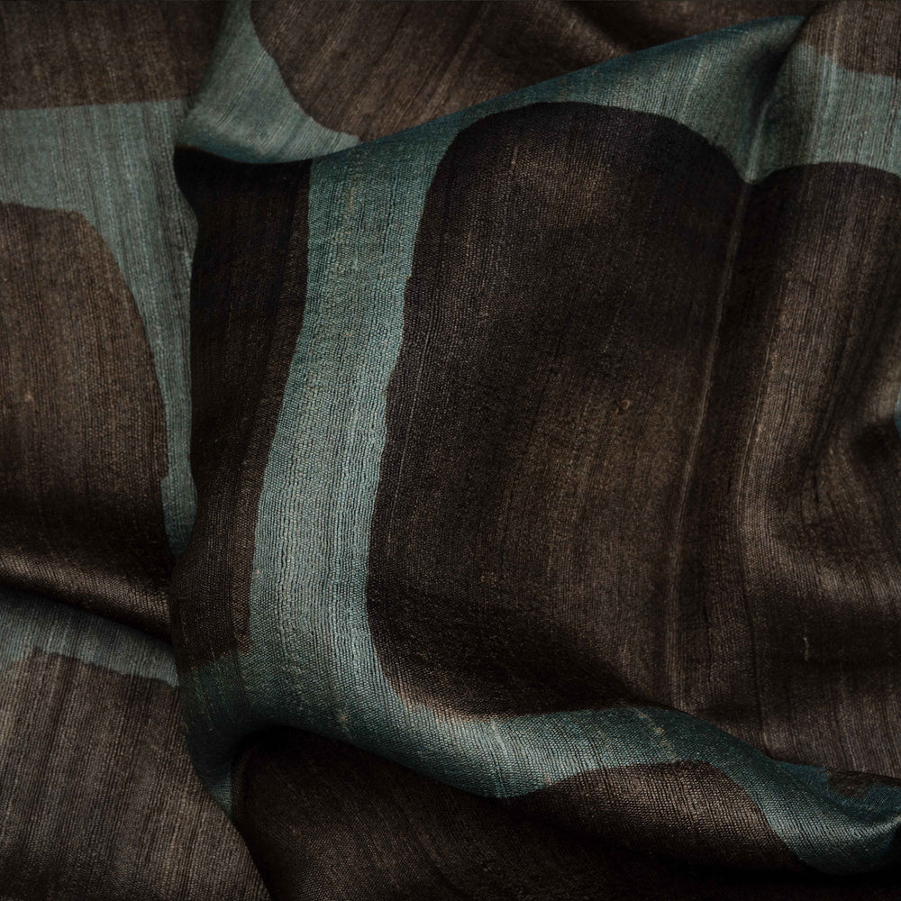 Close-up of brown and green fabric with a textured pattern