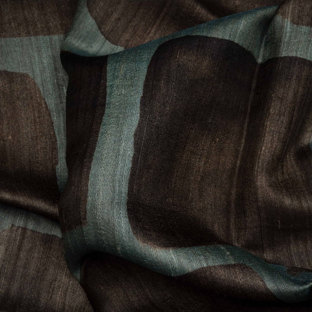 Close-up of brown and green fabric with a textured pattern