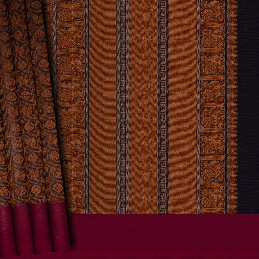 Brown Kanchi cotton saree with annam and chakram checks, maroon border and detailed pallu with matching blouse