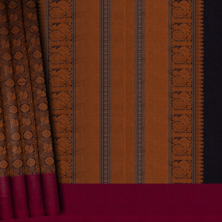 Brown Kanchi cotton saree with annam and chakram checks, maroon border and detailed pallu with matching blouse