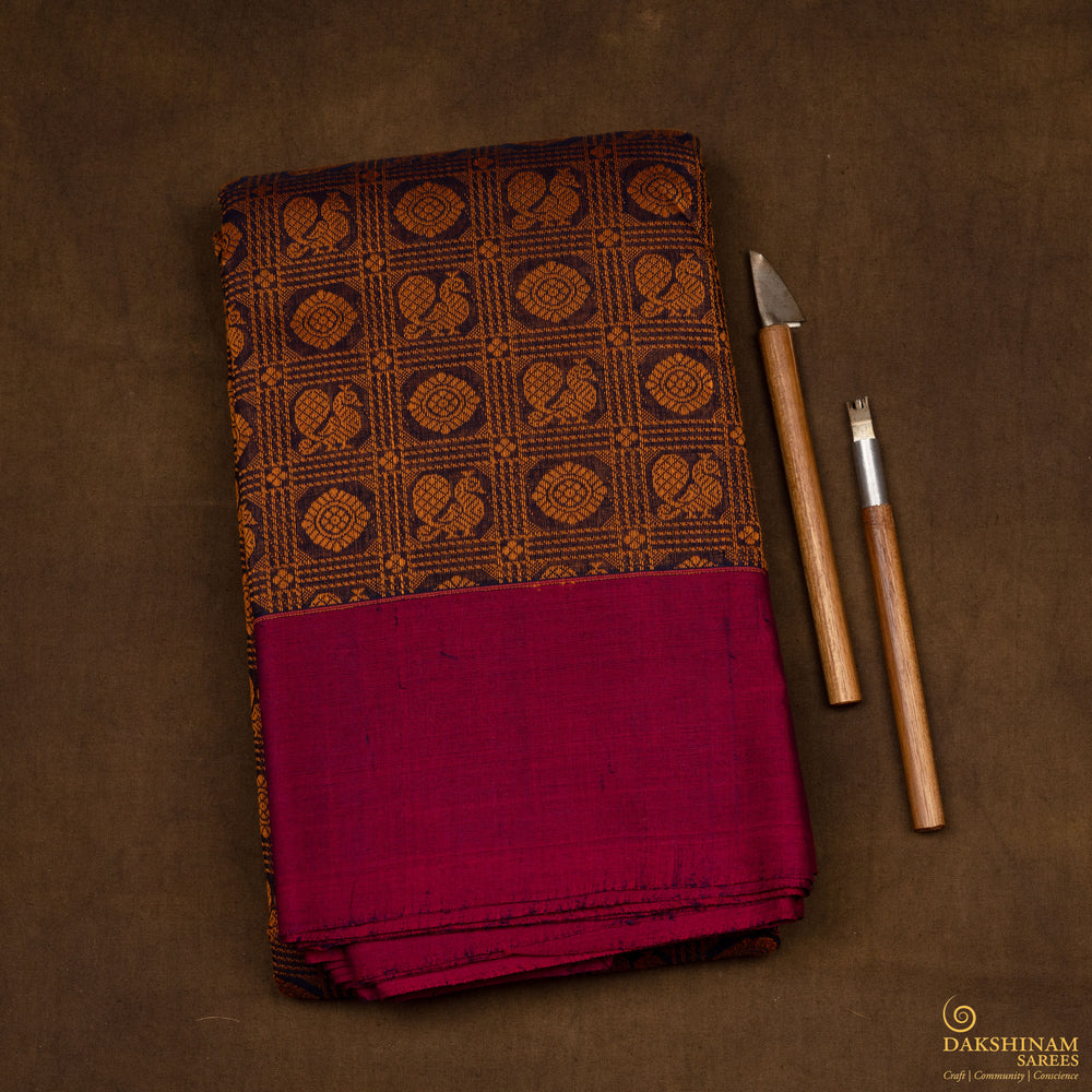 Brown Kanchi cotton saree with annam and chakram checks, maroon border and detailed pallu with matching blouse