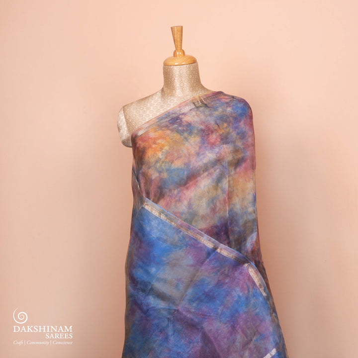 Full view of a Handwoven organza silk saree in sky blue with multicolour abstract strokes.