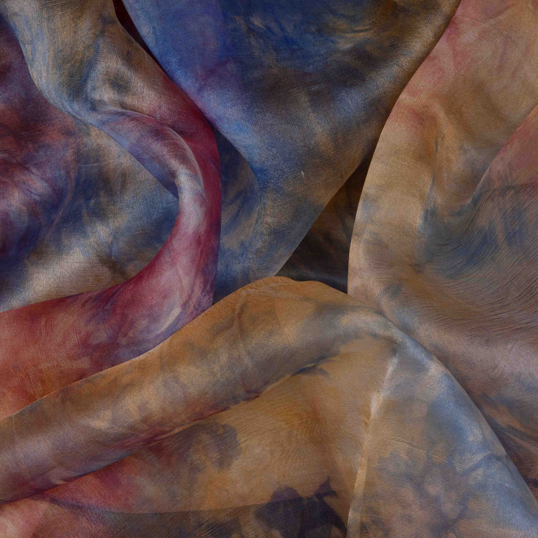 Closeup view of a Handwoven organza silk saree in sky blue with multicolour abstract strokes.