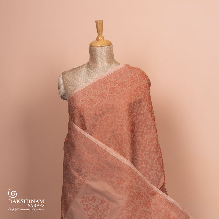 Full body view of Handwoven South cotton saree in gentle peach tone.