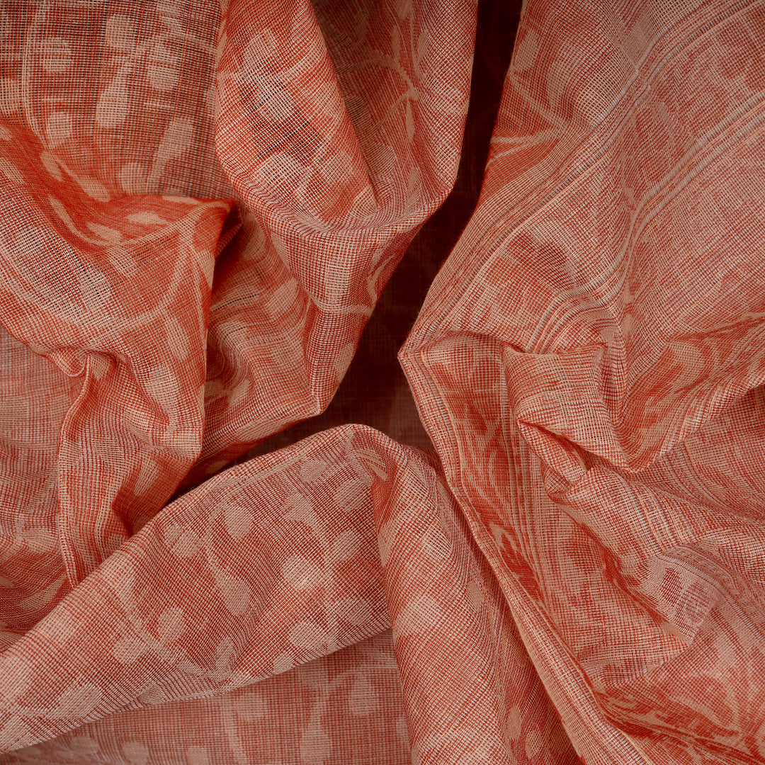 Closeup of Handwoven South cotton saree with floral and leaf vine motifs with delicate dots.