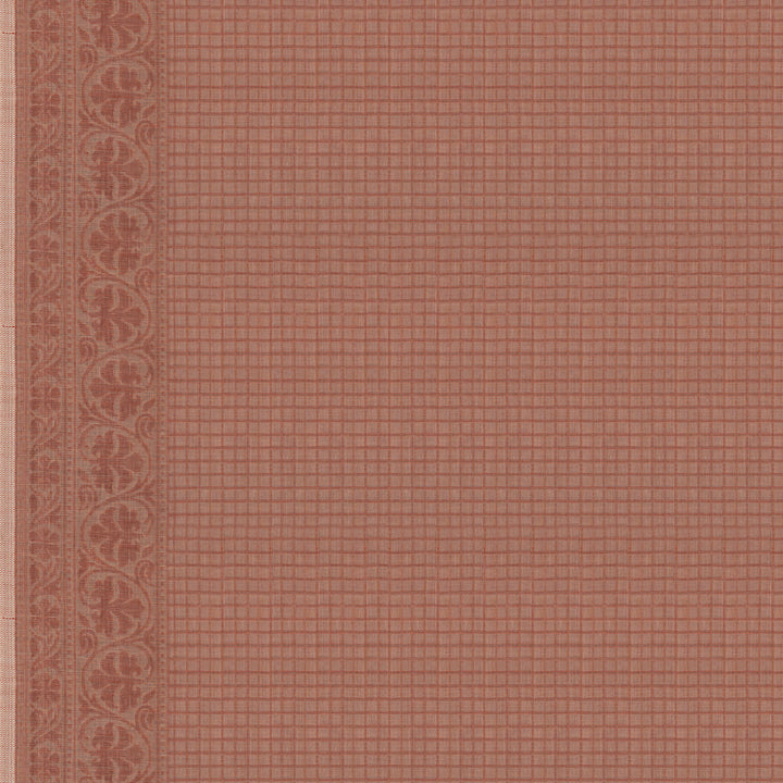 Closeup of checked blouse with bordered edges.