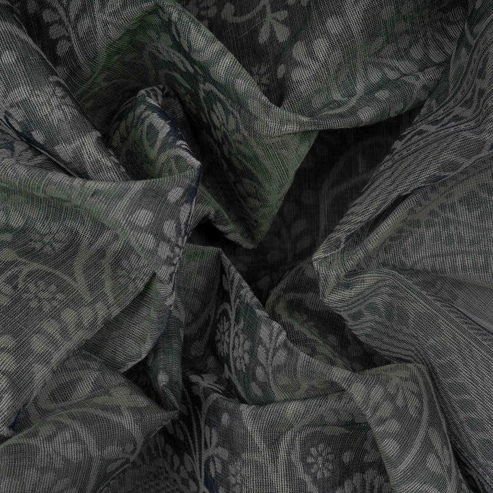 Closeup view of Handwoven grey South cotton saree with floral vines.