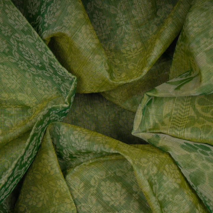 Body Closeup view of a Handwoven green South cotton saree with parrots, floral vines, paisleys.