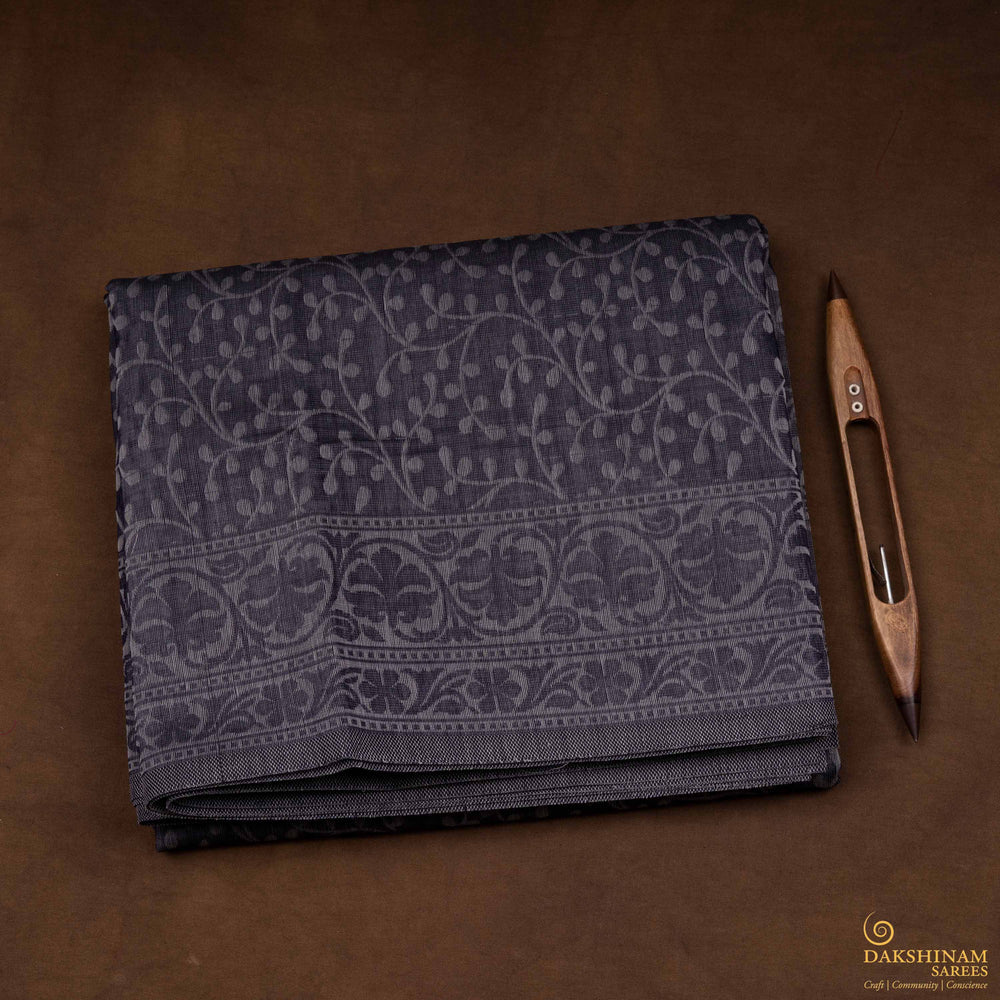Body closeup view of a Authentic grey South cotton saree with floral vines, stripes and plant motifs.