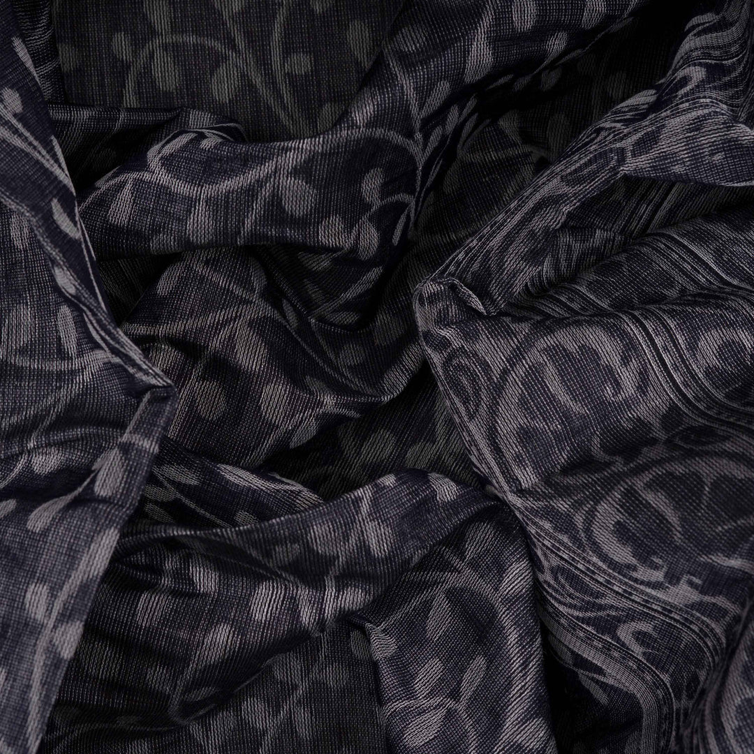 Body closeup view of a Authentic grey South cotton saree with floral vines, stripes and plant motifs.