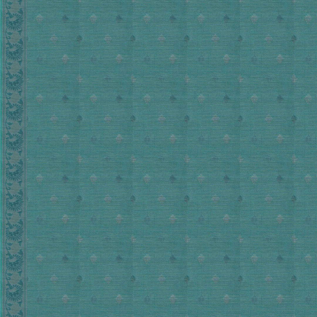 Closeup of a Handwoven aqua blue South cotton saree with diamond-shaped patterns, sunflower and leafy motifs, monotone border  blouse.