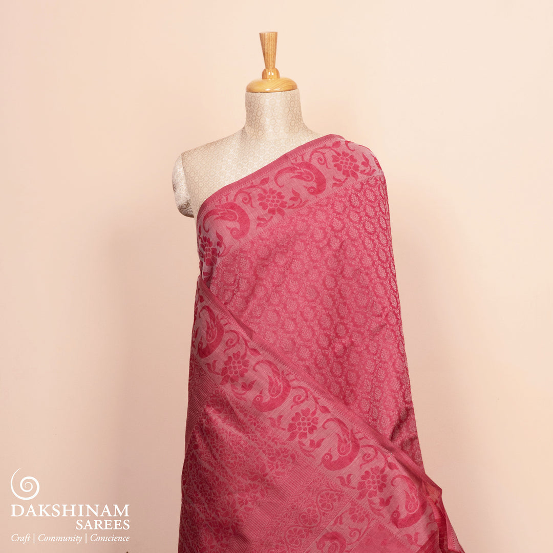 Full view of a Handwoven pink South cotton saree with parrots.