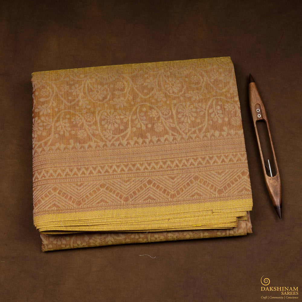 Closeup of Handwoven rust yellow South cotton saree.