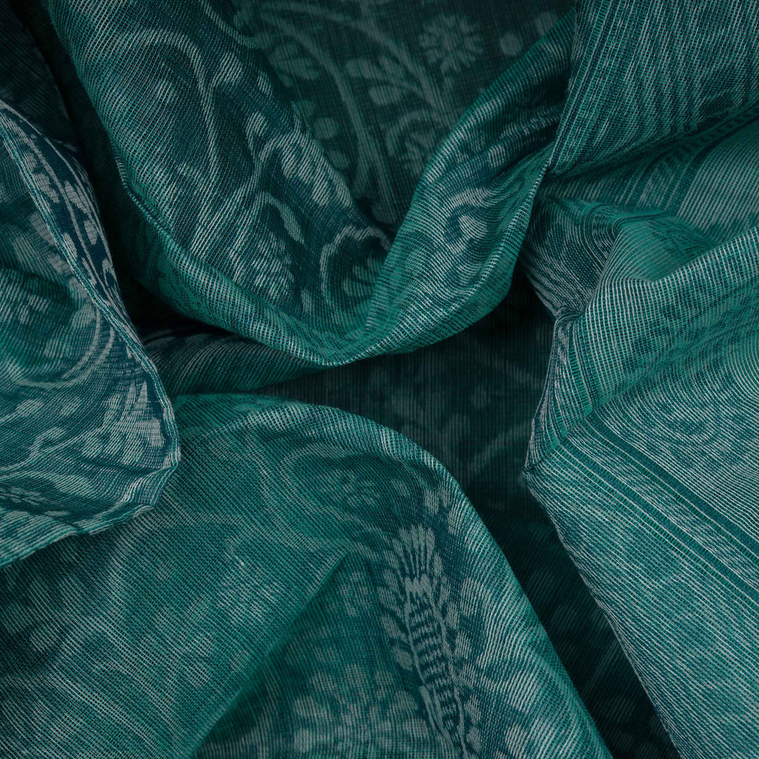 Body Closeup view of a Authentic teal South cotton saree with floral vines, paisleys, chevron stripes and dotted motifs.