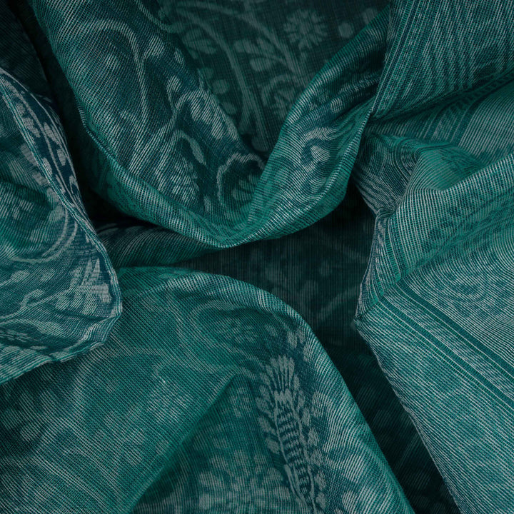 Body Closeup view of a Authentic teal South cotton saree with floral vines, paisleys, chevron stripes and dotted motifs.