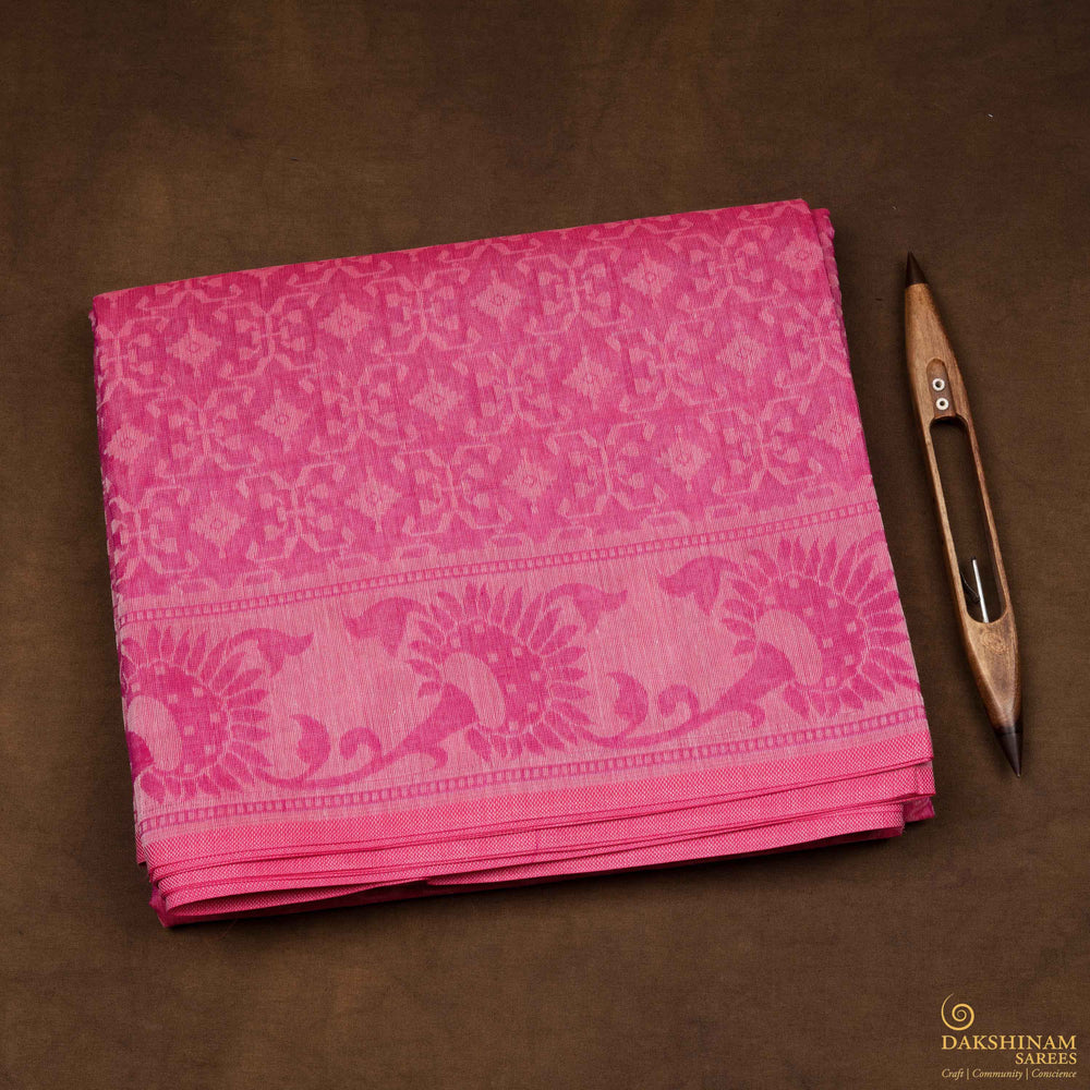 Body closeup view of a Authentic pink South cotton saree with diamond patterns.