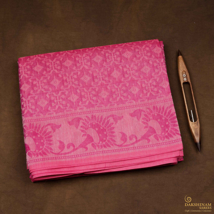 Body closeup view of a Authentic pink South cotton saree with diamond patterns.