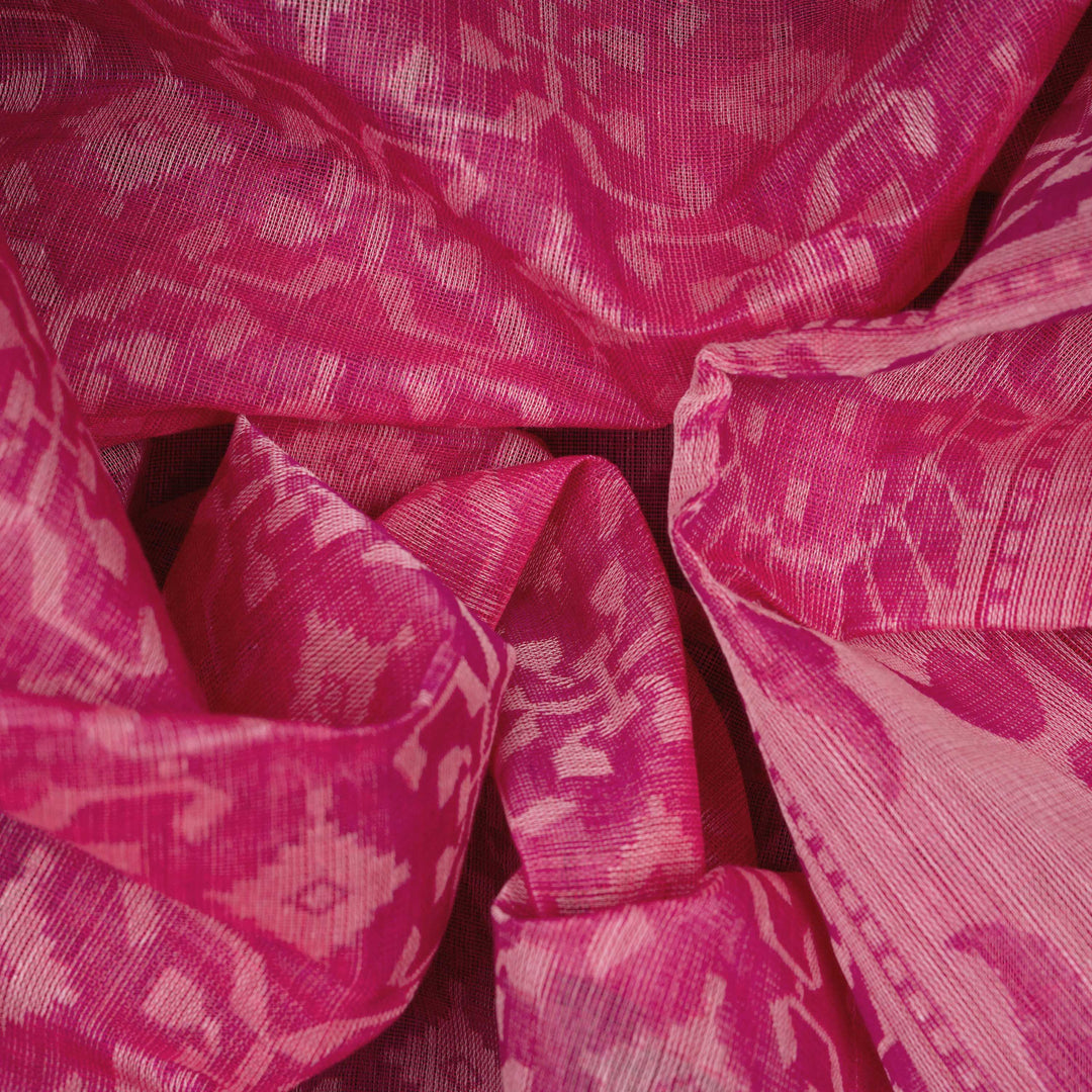 Body closeup of a Authentic pink South cotton saree with diamond patterns.