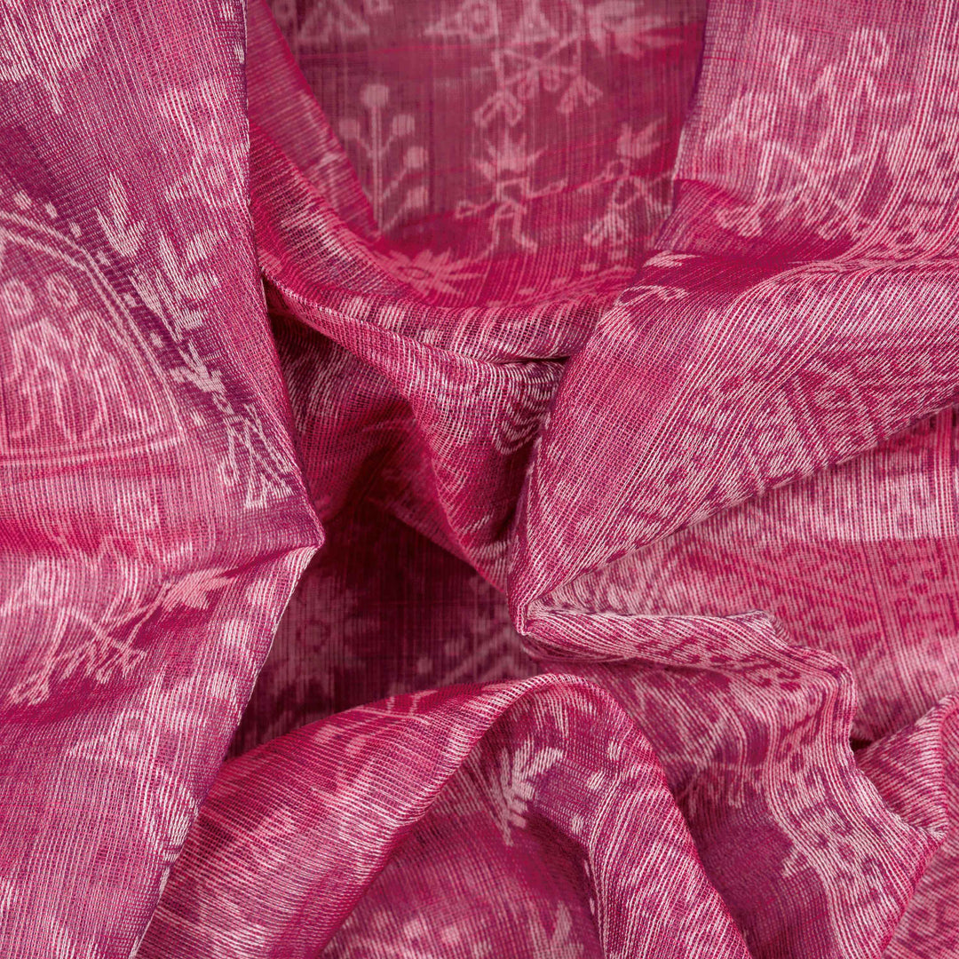 Closeup view of a Authentic pink South cotton saree with hut motifs.