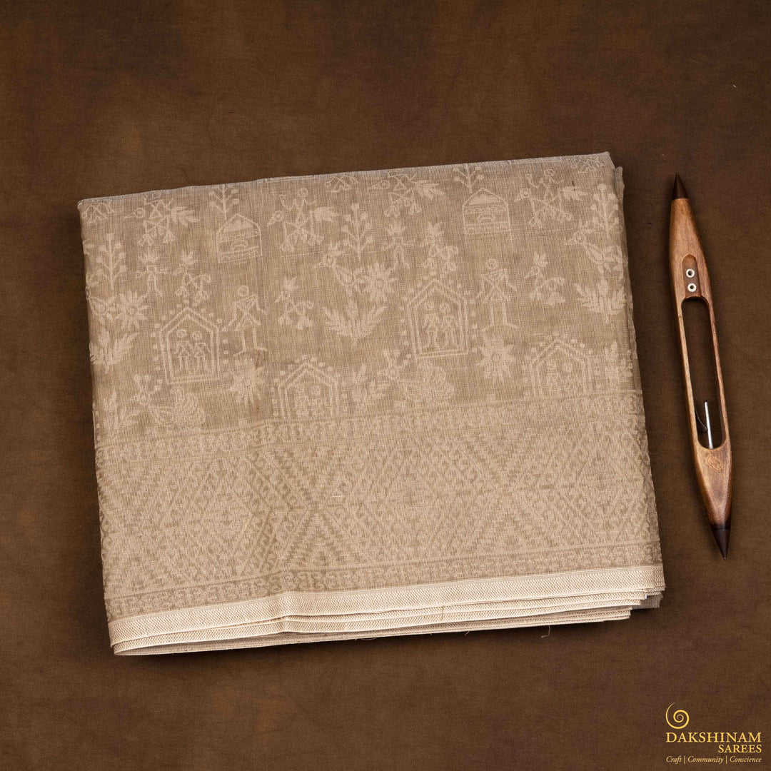 Closeup view of a Authentic beige South cotton saree with hut-shaped motifs, birds, diamond patterns, and stripes with monotone border.