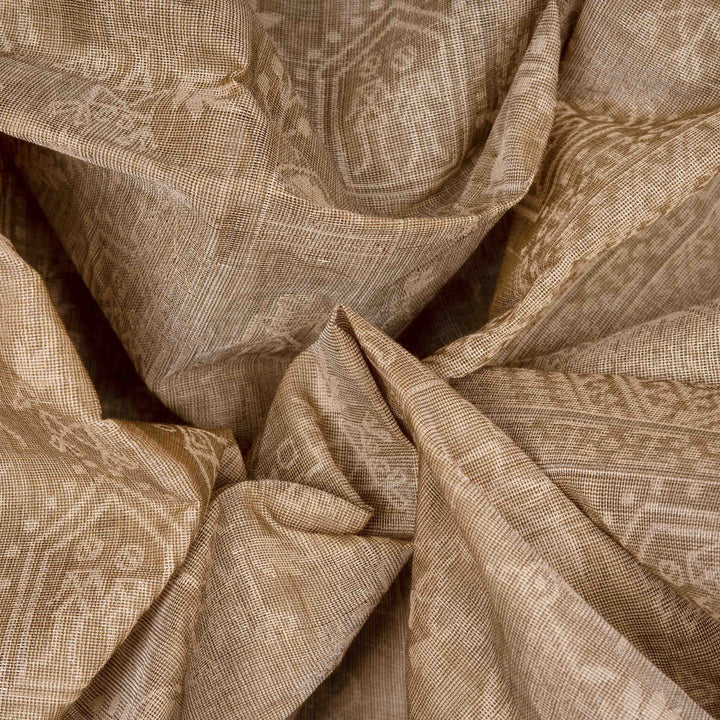 Body Closeup view of a Authentic beige South cotton saree with hut-shaped motifs, birds, diamond patterns, and stripes with monotone border.