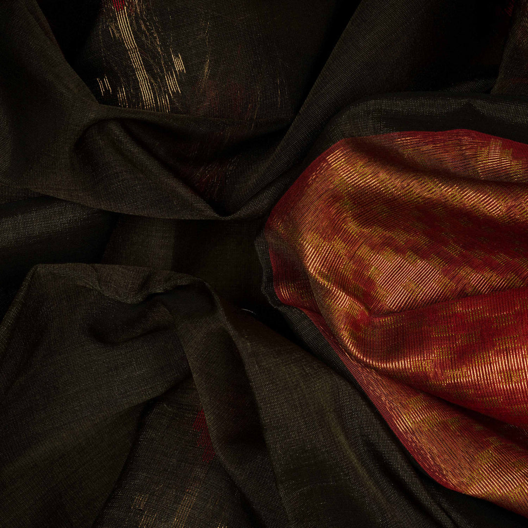 Body closeup of a Lightweight grey silk cotton saree with maroon meenakari floral border.