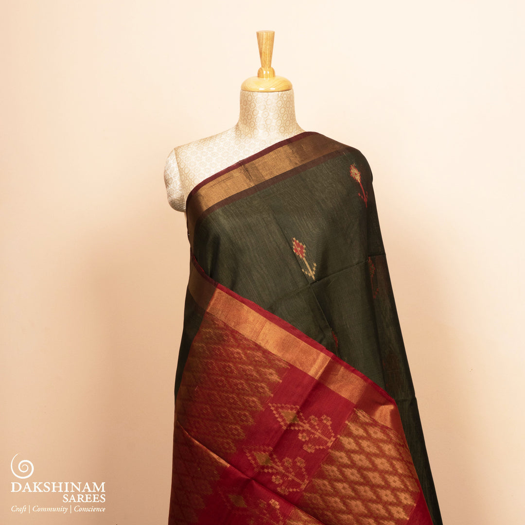 Full view of a Lightweight grey silk cotton saree with maroon meenakari floral border.