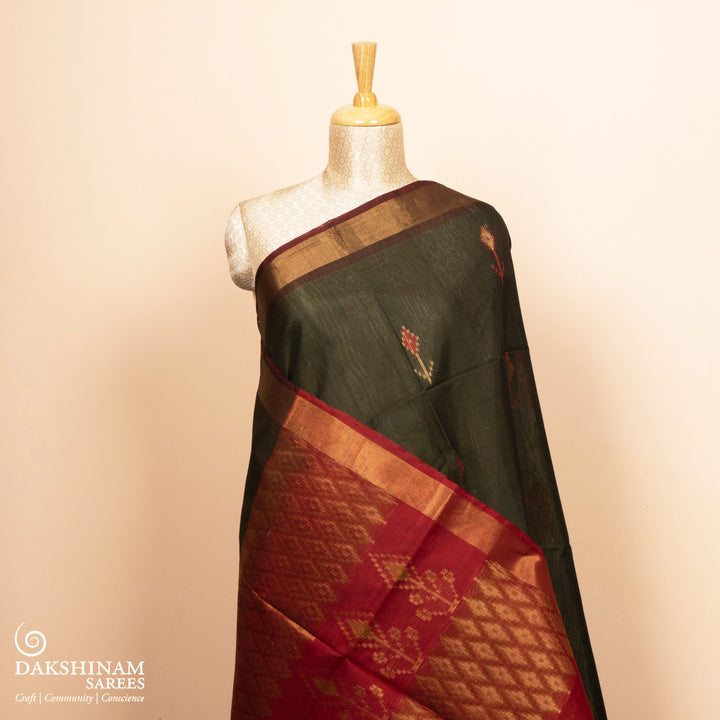 Full view of a Lightweight grey silk cotton saree with maroon meenakari floral border.